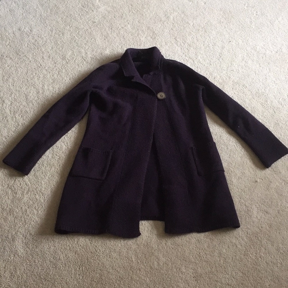 A women’s dark purple long sweater.